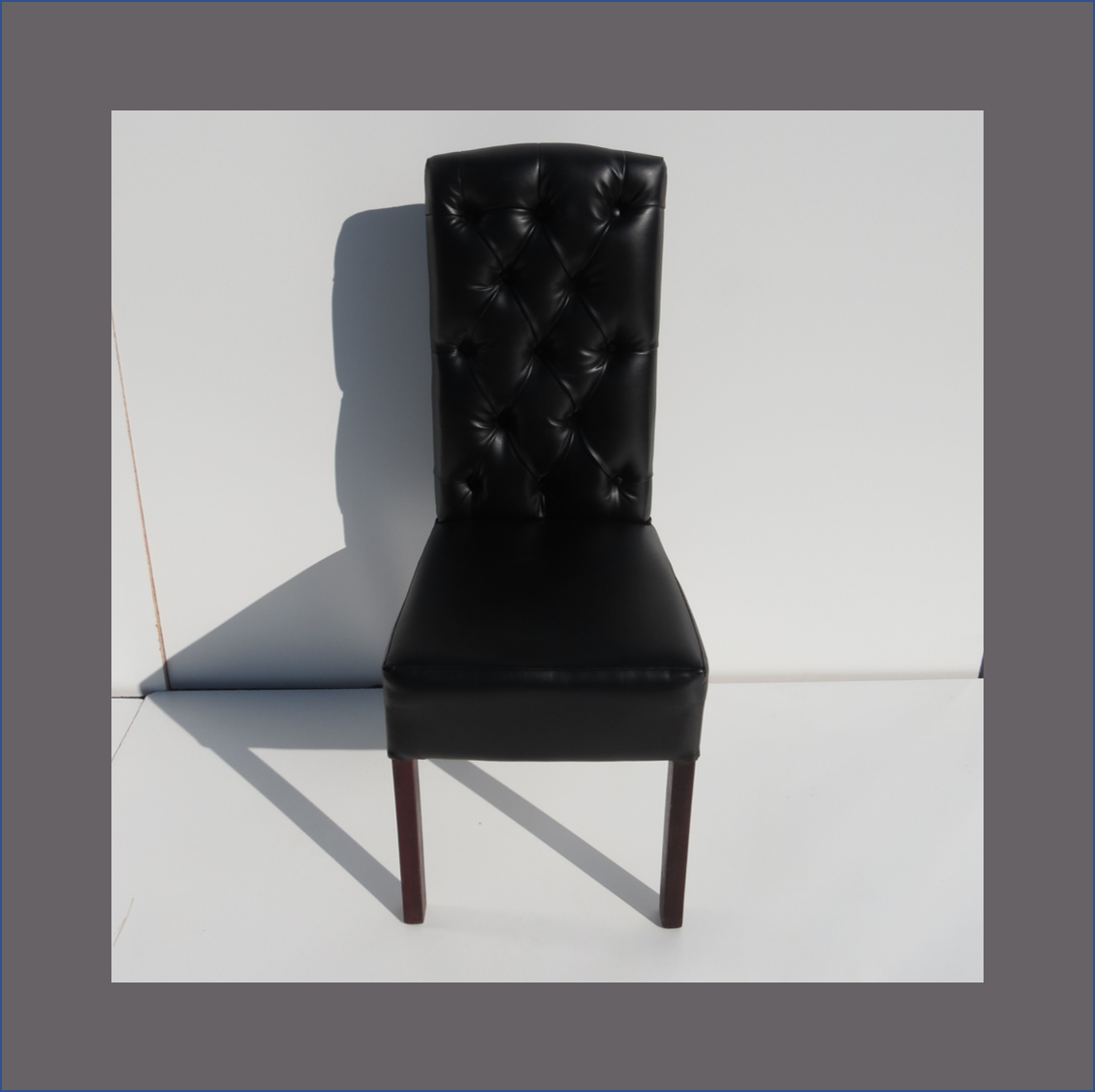 black-deep-buttoned-dining-chair